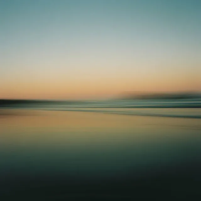 Blurred long exposure of a beach and sea at dusk